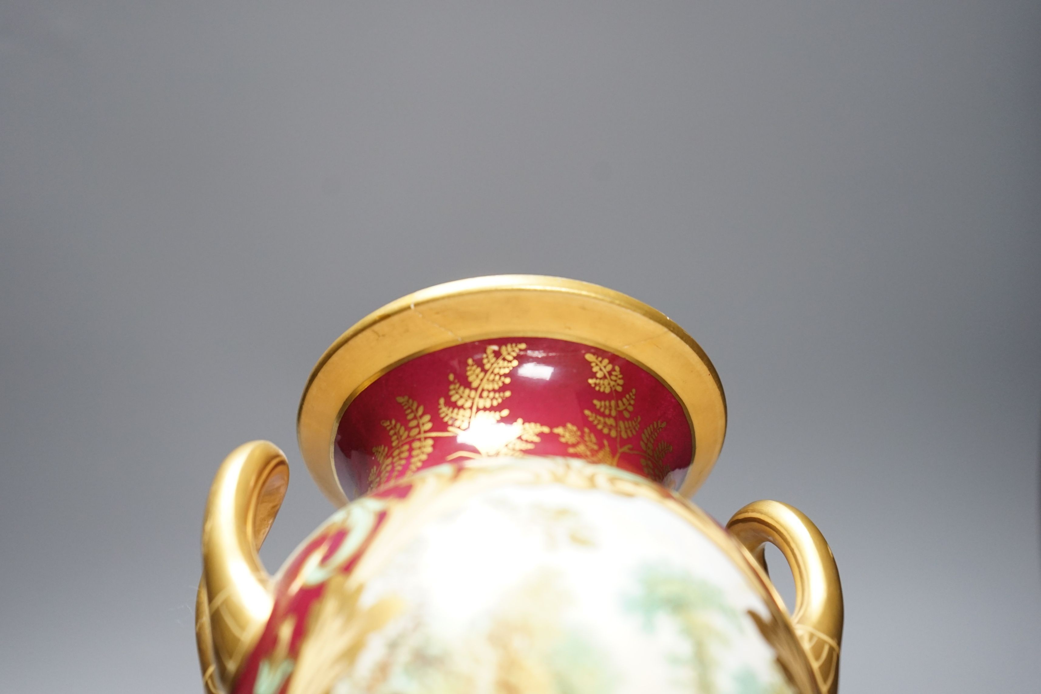 A 19th century English bone china two handled vase, decorated with a central cartouche, in distinctly signed on base, 21.5cms high